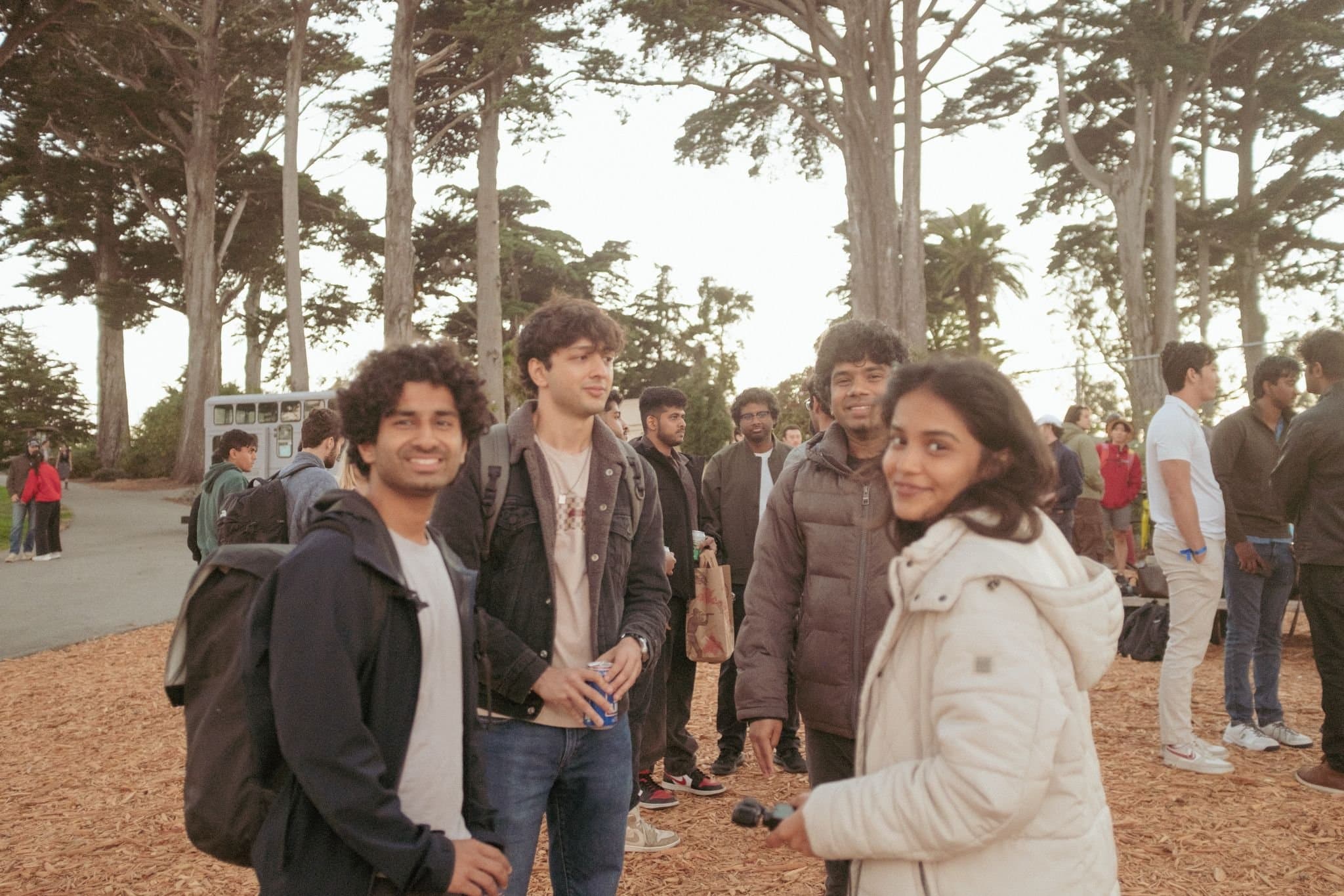 YC Startup School after-party at the Painted Ladies — Guests among the trees